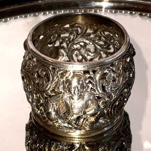 Incredible antique silverplate napkin ring Asian figures must see